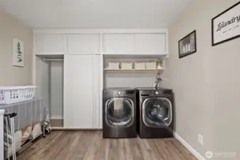 Laundry room with plentiful storage and space