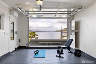 Studio with garage door open to the water.
