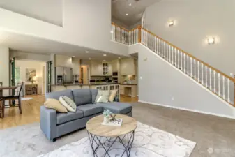 This view shows the office to the left of the kitchen and the built in desk to the right of the kitchen. Under the stairs is a walk in storage closet.