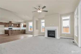 Gas fireplace with mantel and tile surround. Photo for illustration only, not actual