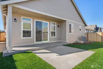 Partially covered back porch with extended patio. Photo for illustration only, not actual