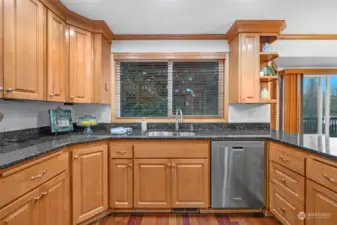 Wash your dishes while gazing out at lovely, private backyard.  Tons of cabinets for your cooking pleasure.