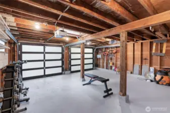 Modern garage doors and freshly painted floors elevate this clean, organized space.