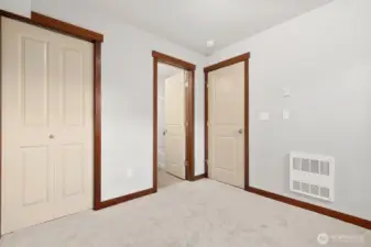 lower level bedroom with it's own full bathroom. Great as an office and/or guest room