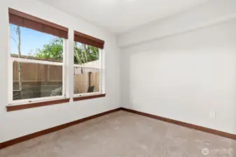 Lower level bedroom faces east and looks out onto the patio.