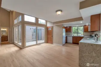 Open-concept dining space filled with natural light—seamless flow from kitchen to living.