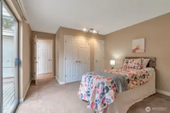 Versatile second bedroom with courtyard deck access—ideal for guests, office, or hobbies.