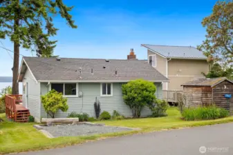 Front of home with storage shed