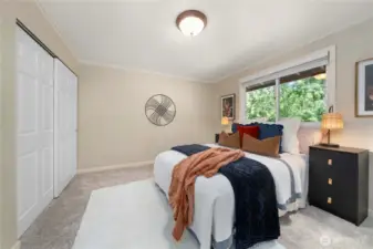 Good sized primary bedroom upstairs also has a view overlooking the greenbelt.