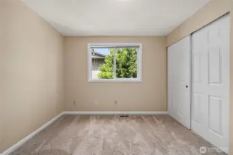 One of two additional bedrooms upstairs.
