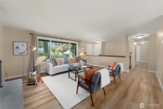 From the front door you flow directly into a large and bright living room with LVP flooring and large picture windows to the front landscaping.