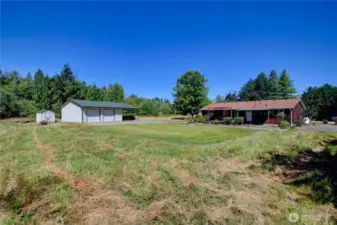 Immaculate home and detached garage/shop on 5 lovely acres