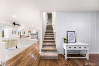 Stairway leads to bonus space and additional bedroom