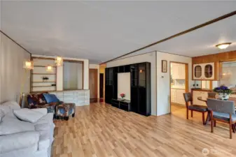 Open floor plan with living room with dining area. Large windows bring in a lot of light.