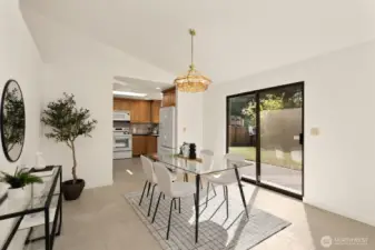 Dining room with slider leading to your backyard