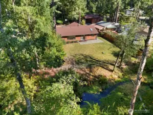 Home sits on just under 1 acre and backs up to Rock Creek