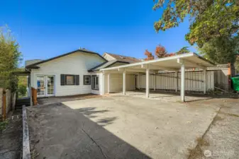 Parking for up to 3 cars w/1 covered space under carport