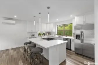 All brand stainless steel appliances, including Kitchen Aide dual fuel range, plus new fridge/freezer and dishwasher.