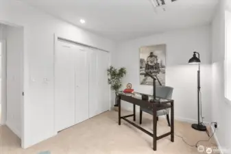 View of 3rd bedroom looking towards entry door and closets.