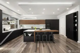 The chef's kitchen is designed for creating culinary magic with it's high-end appliances and adjacent spice kitchen.