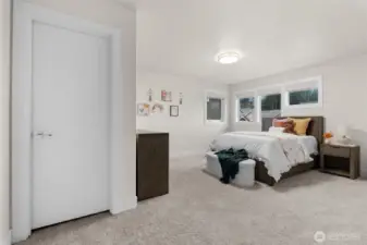 Third bedroom with plentiful space, showcasing it's personal walk-in closet.