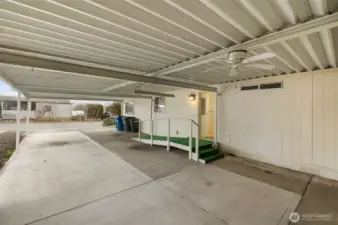 Covered carport featuring ramp access for easy entry into the home.