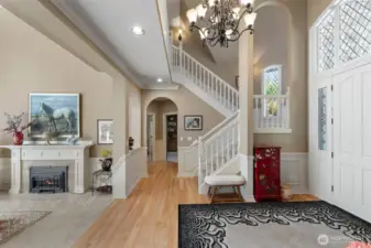 living room on left, front door on right, master bedroom ahead on left, den/office on right