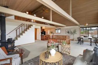 Another view of the great room looking towards kitchen and stairs to lower level.