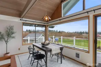 Dining area looking onto HUGE wrap around view deck!
