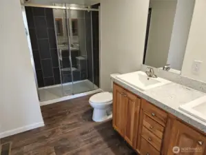 Tile walk in shower with glass sliding doors