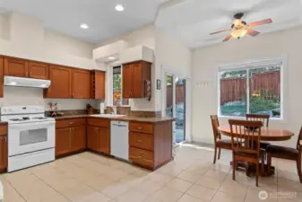 Kitchen w/ Breakfast Nook and Slider Out to Covered Patio