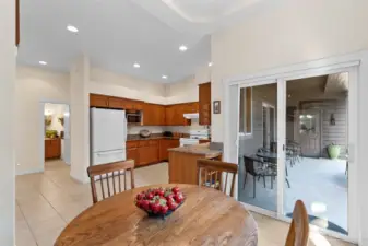 Kitchen w/ Breakfast Nook and Slider Out to Covered Patio