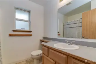 Full bathroom located in the hall outside bedrooms two and three.