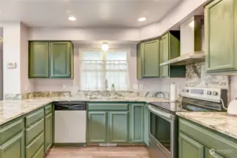 Look at the gorgeous quartz counters and painted cabinets!