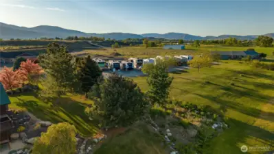 Large mature trees on the side of the home adds privacy. Income producing RV Park next door.