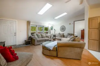 Vaulted living room with skylights.