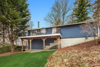 Side view shows outside stairs from garage level to lower level exterior entrance.