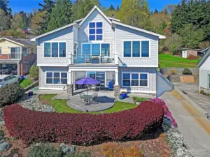 Street side elevation and lovely grounds which include wisteria, raspberries and lots of nice ornamentals.