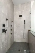 Large walk-in shower with several jets, rain showerhead and wand, plus easy-access valves for "wet-free" operation!