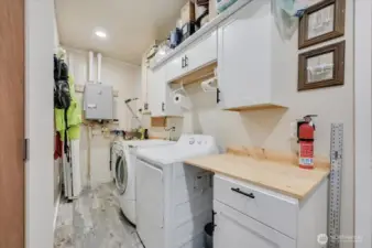 Utility room.  Tankless water heater.