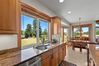 Kitchen flows into dining area with sliders that flow into the back patio.
