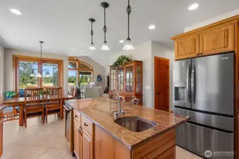 Island with sink and wine fridge.