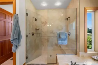 Dual shower heads in extra large walk-in shower.