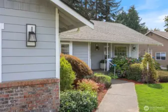 Drop by for a visit - you'll be greeted with a new lawn and rocking-chair front porch. Tidy and well-cared for exterior shines with pride.