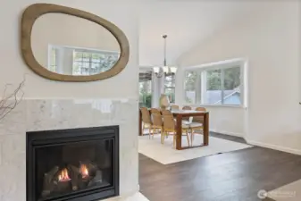 Custom Italian marble surround on this 2022 fireplace - warmth & beauty.