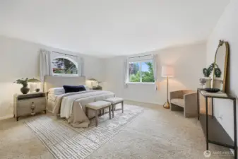 Large and bright primary suite also looks to the backyard.