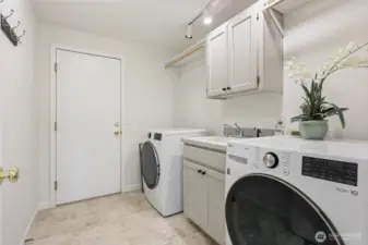 Why yes- the look of the home continues even into the utility room. Two year old washer & dryer set stay with the home and complete this laundry center.