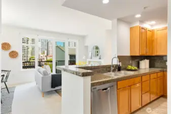 The space is open and bright with clear sightlines to the balcony and city views.