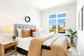 The spacious bedroom is also open and light.