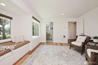 Looking back at the entrance to the Primary Suite and to the Primary full bath.